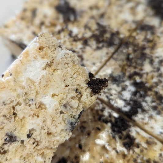 close up of cookies and cream rice cereal treat with bits of marshmallow